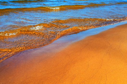 Soft wave on the sandy beach