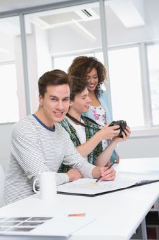 Students working with picture and camera at the college