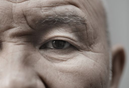 Face of elderly man looking at camera. Horizontal photo