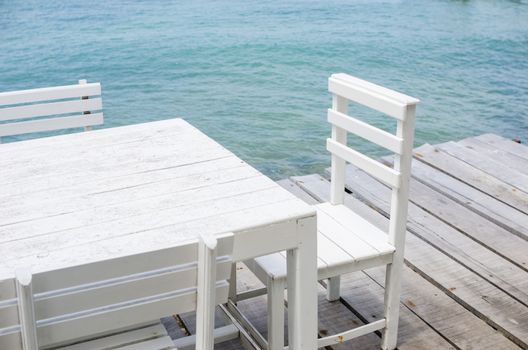 Wood dock White chair and table in Koh Samet Thailand