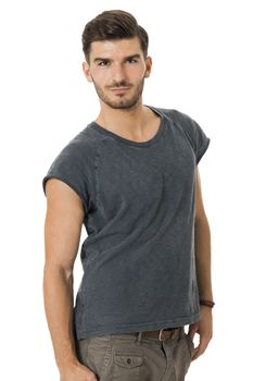 Handsome bearded young man with a lovely charismatic smile wearing a cotton t-shirt, isolated on white