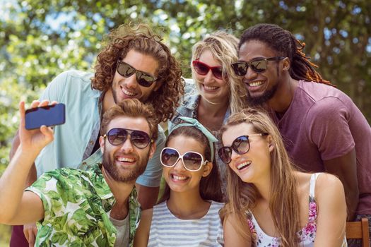 Happy friends taking a selfie on a summers day