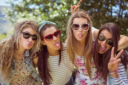 Happy friends posing together on a summers day