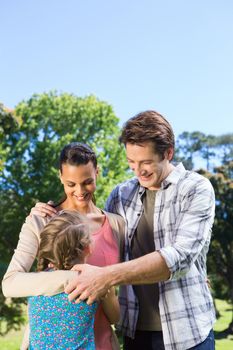 Happy family in the park together on a sunny day