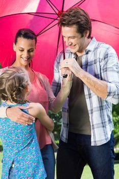 Happy family in the park together on a sunny day