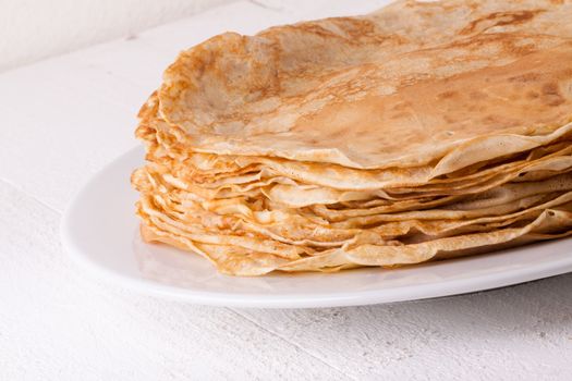 Delicious Pancakes on Plate Served, Isolated on White Wooden Table