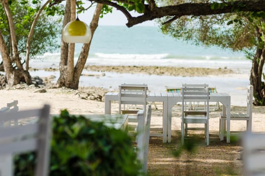 Wood dock White chair and table in Koh Samet Thailand