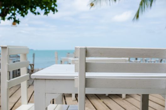 Wood dock White chair and table in Koh Samet Thailand