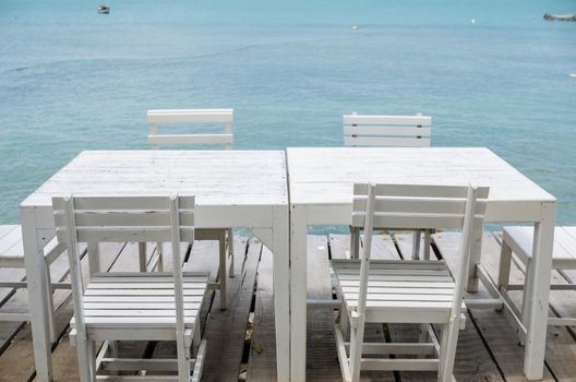 Wood dock White chair and table in Koh Samet Thailand