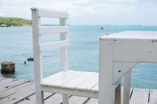 Wood dock White chair and table in Koh Samet Thailand