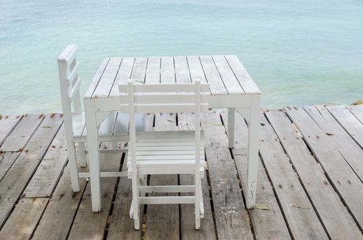 Wood dock White chair and table in Koh Samet Thailand