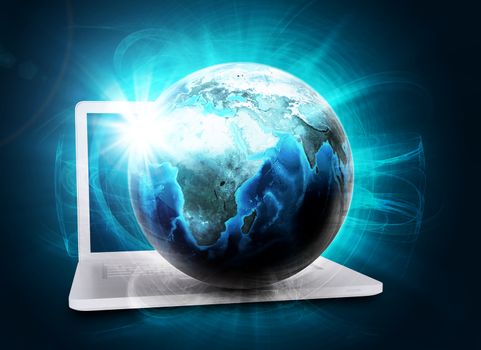 Earth model in haze on laptop on abstract blue background. Elements of this image furnished by NASA