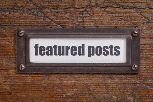 featured posts   - file cabinet label, bronze holder against grunge and scratched wood