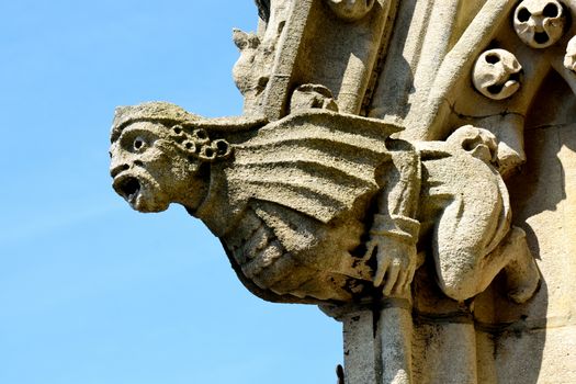 Stone gargoyle on church spire