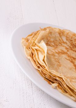 Delicious Pancakes on Plate Served, Isolated on White Wooden Table