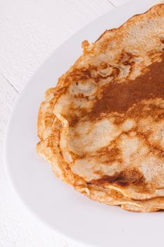 Delicious Pancakes on Plate Served, Isolated on White Wooden Table