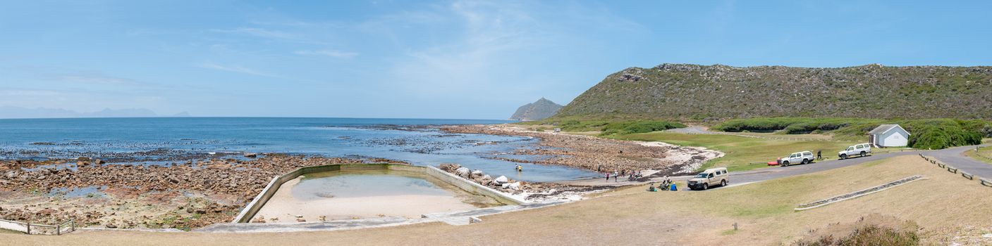 CAPE TOWN, SOUTH AFRICA - DECEMBER 12, 2014:  Beach scene at Bordjiesrif in the Cape Point section of the Table Mountain National Park. Cape Point is in the distance