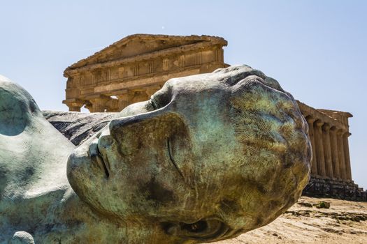 Concordia Temple behind the bronze sculpture of Icarus, person of greek mythology - Valley of the temples 