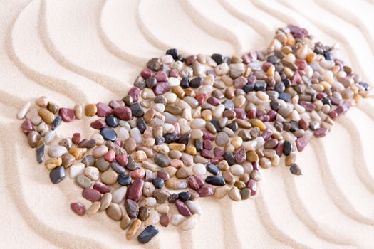 High Angle View of Map of Turkey Shaped from Colored Polished Pebbles on Wavy Beach Sand