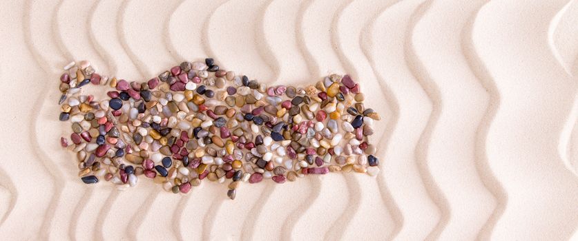 High Angle View of Map of Turkey Shaped from Colored Polished Pebbles on Wavy Beach Sand, Panoramic Image with Copy Space