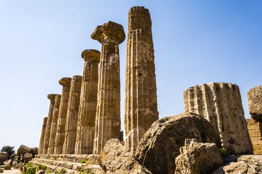 Ancient columns of Hercules Temple at Italy, Sicily, Agrigento. Greek Temples Valley.