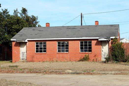 Abandoned public housing structure.  These brick houses were built over 50 years ago to house poor families as part of a government assistance program.