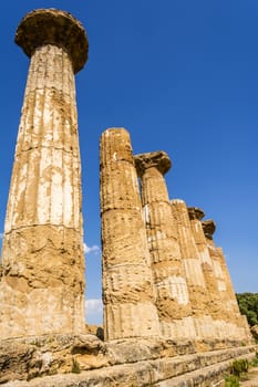 Ancient columns of Hercules Temple at Italy, Sicily, Agrigento. Greek Temples Valley.