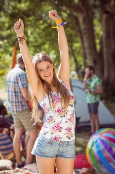 Pretty hipster posing for camera at a music festival 