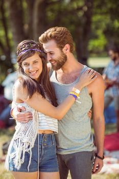 Hipster couple posing for camera at a music festival 