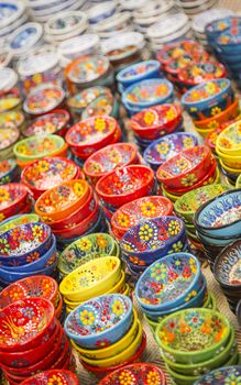 Beautiful Hand Painted Turkish Bowls on Table at the Market.
