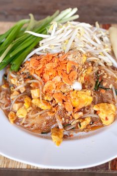 Pad thai or phat thai is a stir fried rice noodle dish.
