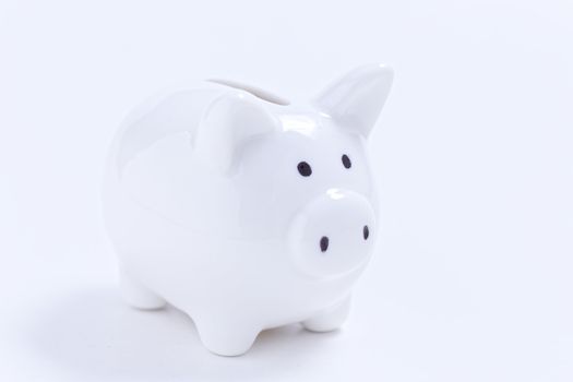 White piggy bank on white background.