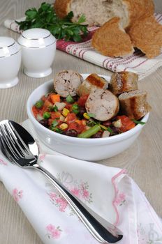 Slices of homemade sausages with vegetables