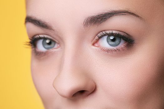 Beautiful girl on a yellow background