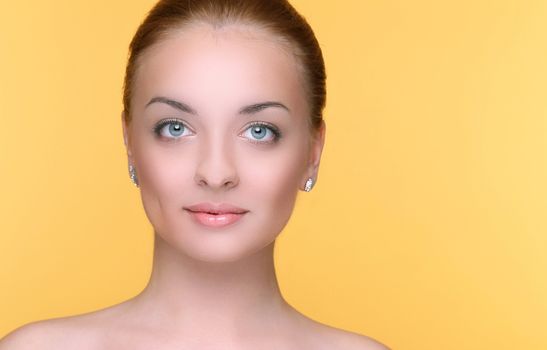 Beautiful girl on a yellow background