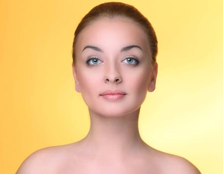 Beautiful girl on a yellow background