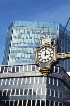 Clock and buildings in London