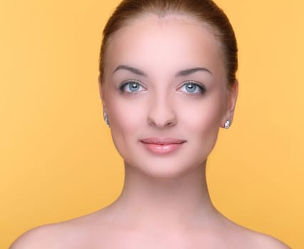 Beautiful girl on a yellow background