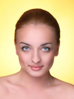 Beautiful girl on a yellow background