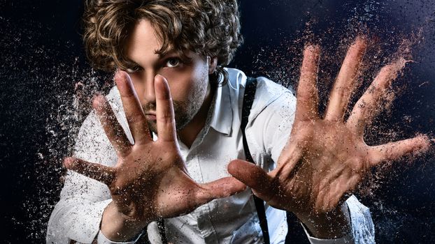 image of a man who performs magic with his hands