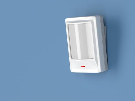 Motion detector attached on blue wall