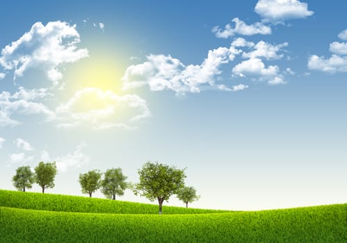 Green field under blue sky with white clouds, nature background