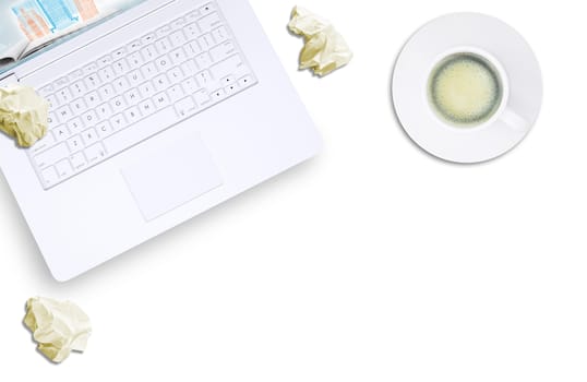 White laptop, espresso and crumpled piece of paper on isolated white background, top view. Closed up