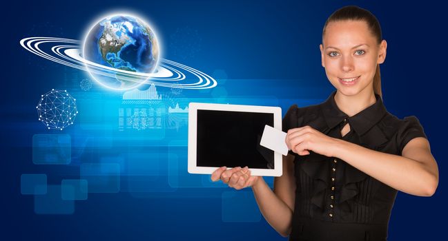 Smiling young woman holging tablet and blank card with 3d Earth model with graphical charts and looking at camera on abstract blue background. Elements of this image furnished by NASA