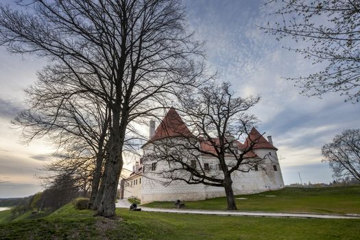 Bauska castle restored part during sunset time. HDR image