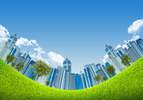 Cityscape bug eye view on green grass under blue sky with white clouds