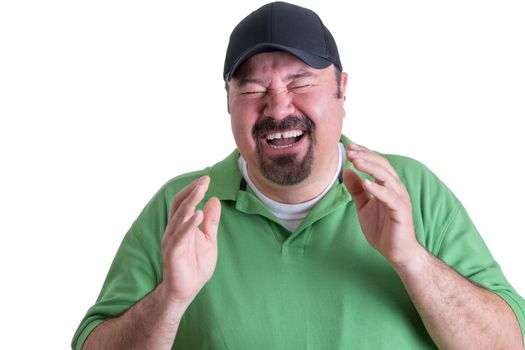 Portrait of Overweight Man Wearing Green Shirt and Black Baseball Cap Laughing Ecstatically in front of White Background, Head and Shoulders Portrait of Joyful Man