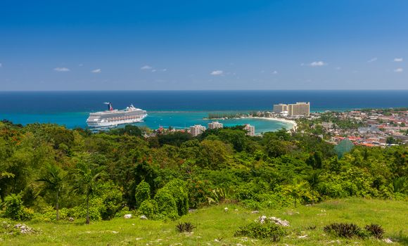 Jamaican Beach A. Caribbean white sand beach on the northern coast of Jamaica, near Dunn's River Falls and the town of Ocho Rios.