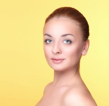 Beautiful girl on a yellow background
