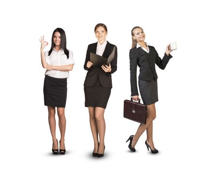 Image of three successful businesswomen looking at camera on isolated white background